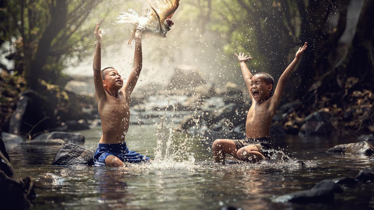 Happy children splashing water