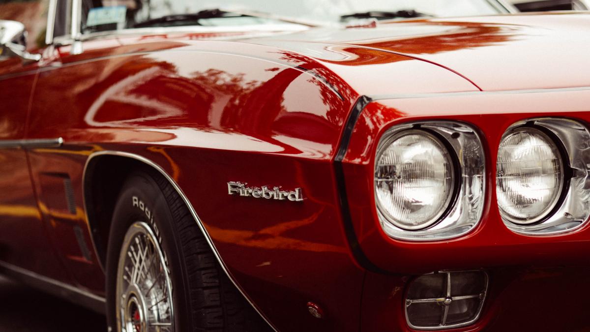Vintage red Pontiac Firebird (Unsplash)