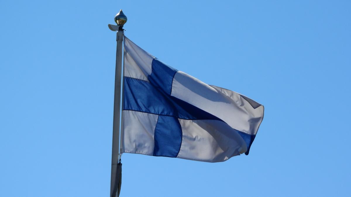 Finland flag in wind on a flagpole