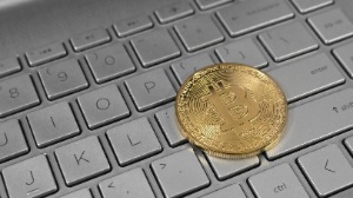 Bitcoin on Laptop Keyboard Bitcoin on Laptop Keyboard