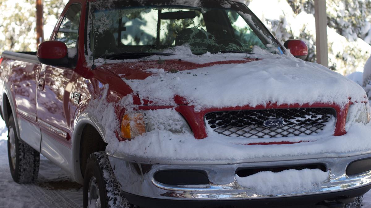 Red Ford F-150 covered partially in snow (5311459472) Red Ford F-150 covered partially in snow (5311459472)